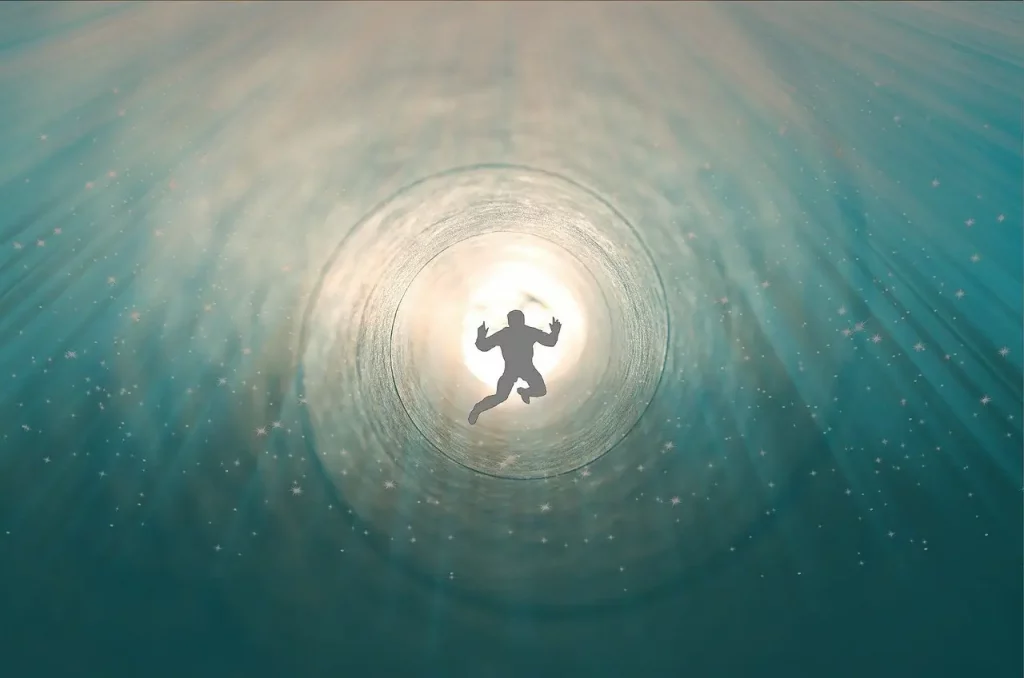 Explorez l'expérience transcendante capturée dans cette image captivante : un homme semblant être happé, tel un voyageur dans un tunnel, suspendu comme en apesanteur. Au cœur de cette scène intrigante, une lumière blanche éclatante émerge, évoquant un passage mystique. Plongez dans l'inconnu avec cette représentation visuelle unique.