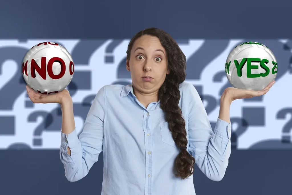 Dans cette image évocatrice, une femme est capturée au milieu d'une profonde réflexion. Tenant dans chaque main une boule indécise, elle semble naviguer entre les choix du oui et du non, représentant ainsi le tumulte intérieur souvent associé à la dépendance. Son expression interrogative témoigne de son désir ardent de trouver la voie vers l'autonomie et la confiance en soi. C'est une représentation puissante du voyage intérieur nécessaire pour surmonter la dépendance et retrouver le contrôle de sa propre vie.